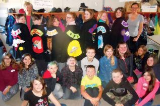 Miss Graham and textile artist Elinor Rush with grade six students at Perth Road PS and their “character capes”